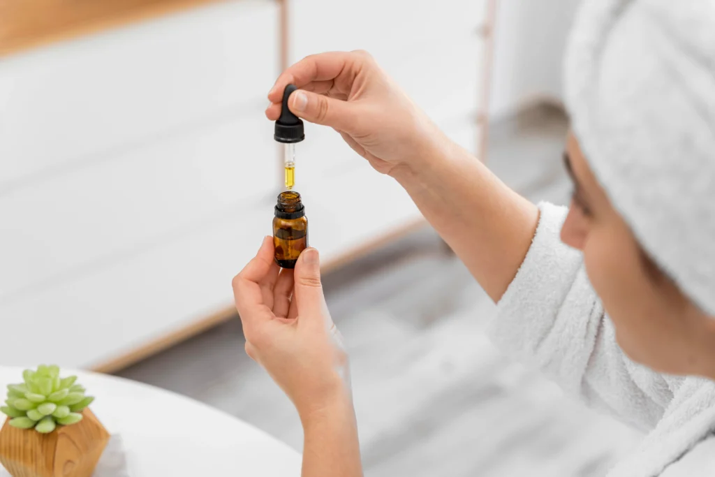 close-up-woman-holding-serum